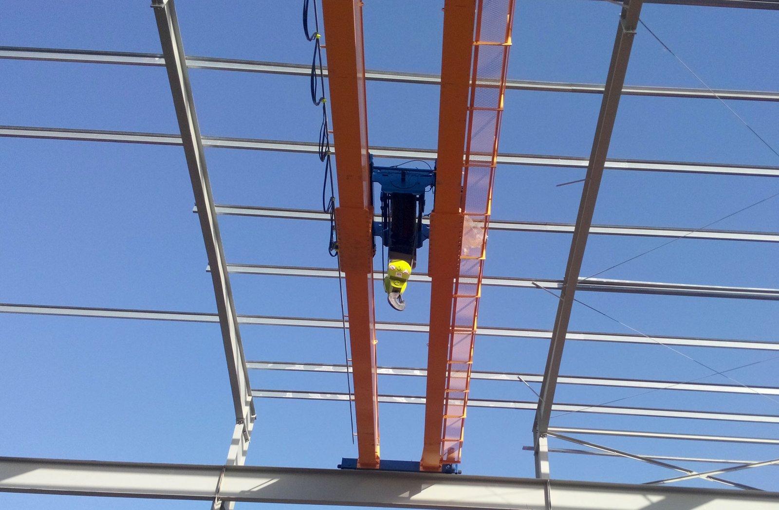 Turkish-built Wimac low ceiling crane lifting a load in a workshop bay