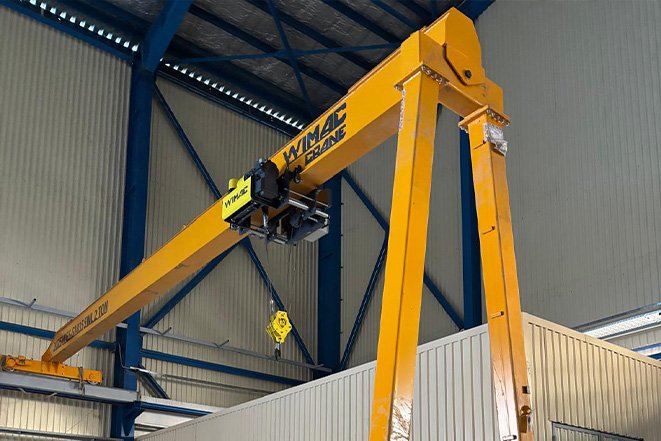 Wimac Turkey producing a semi-gantry crane hybrid leg structure with a ground rail and an elevated wall rail